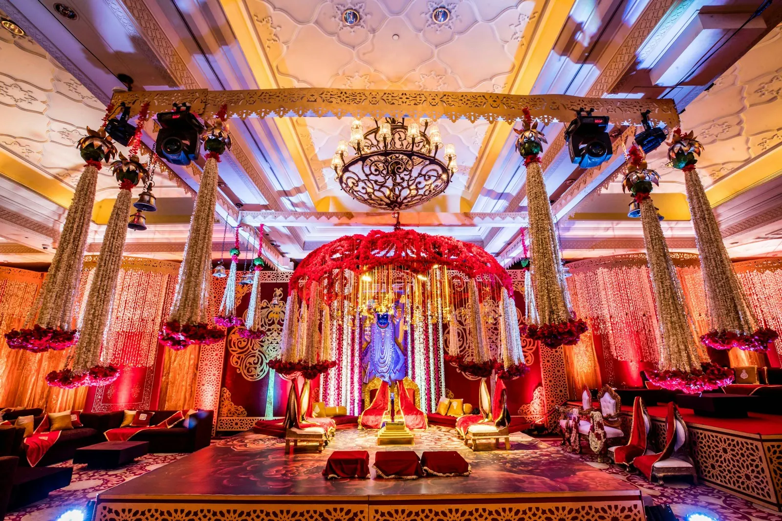 Grand wedding mandap décor with chandeliers and florals in Bengaluru